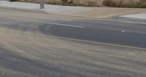 image of soil tracked out onto a roadway from a construction site